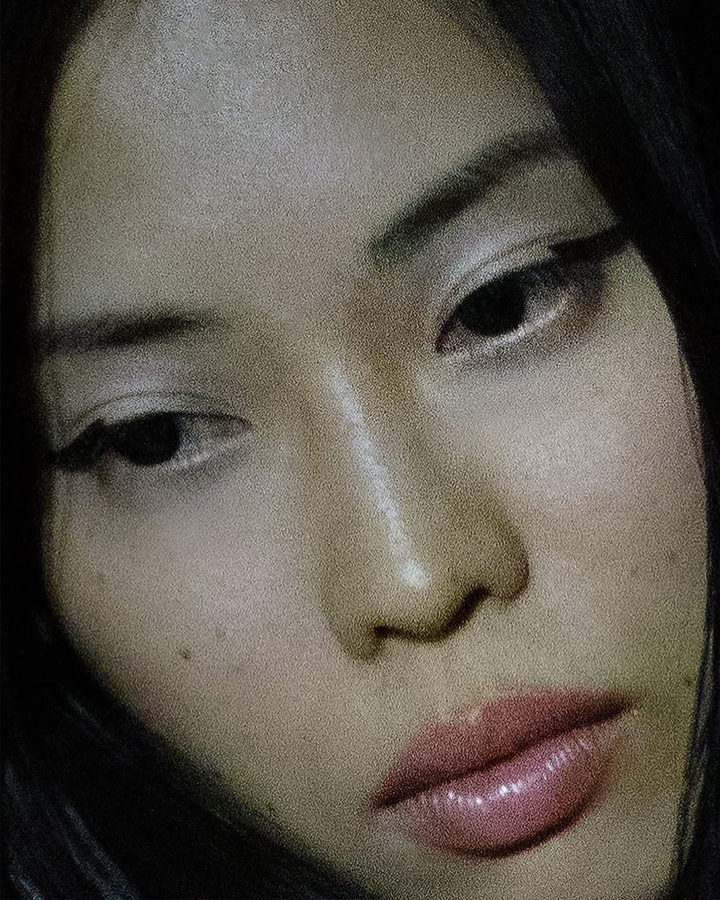 Close up of a female model with natural makeup and wing liner.